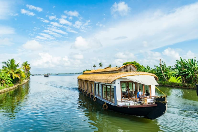 Air-conditioned wooden panel room interior with premium white bed on houseboat